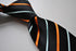 navy with orange and light blue striped tie